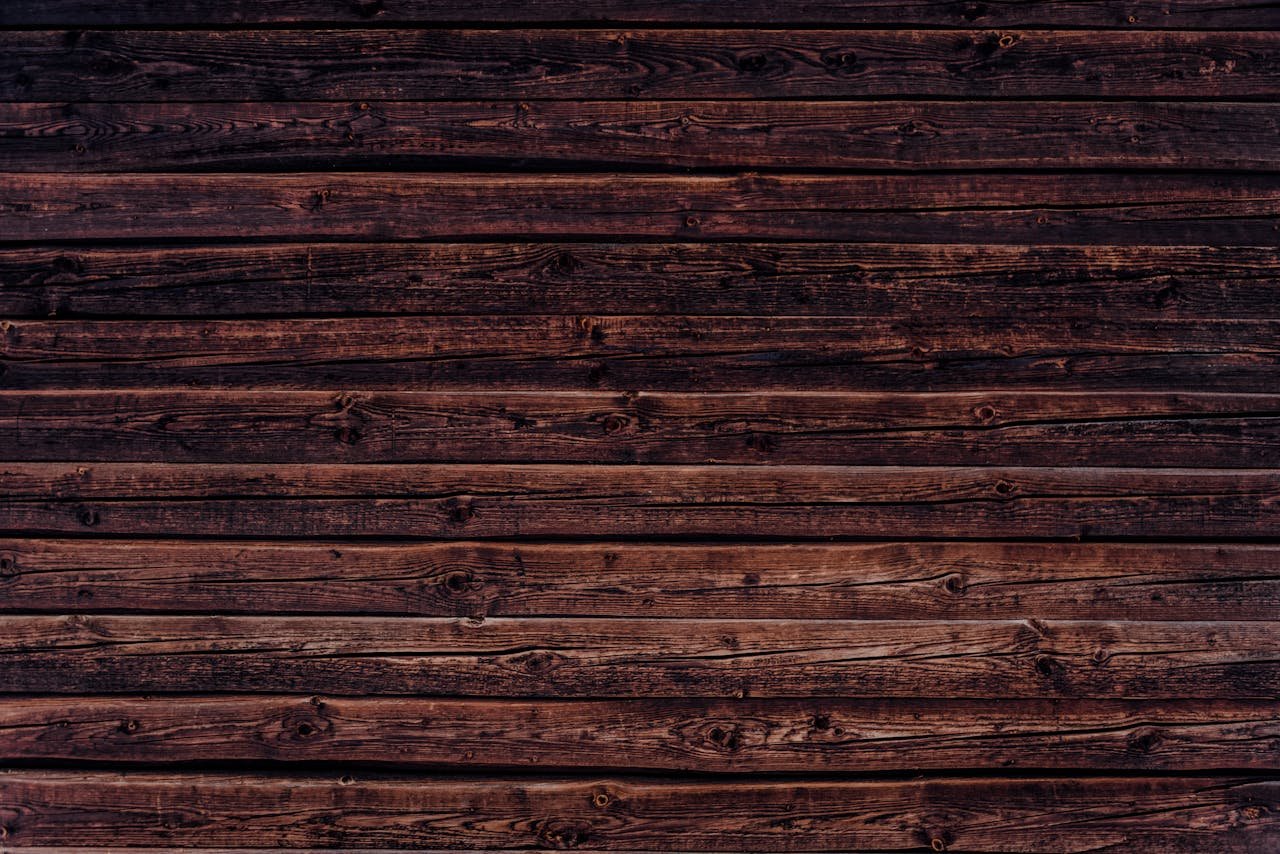 High-resolution image of dark wooden planks creating a rustic background.